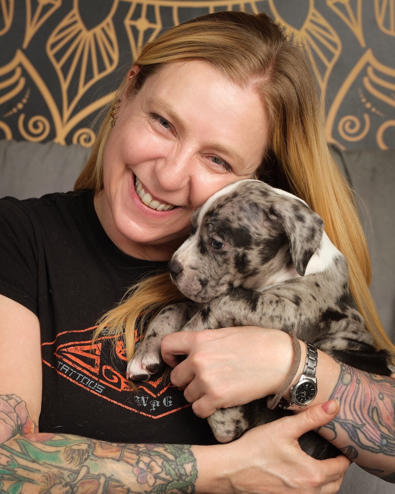 South of Heaven piercer Terri holding a puppy